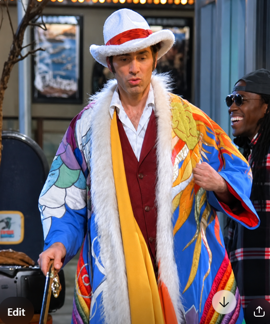 Men's multicolor patchwork coat with white fur trim and open front