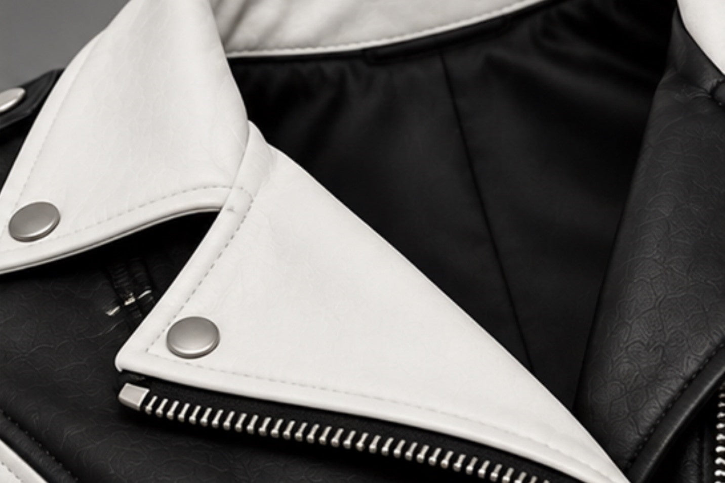Women’s black and white leather biker jacket lapel collar details