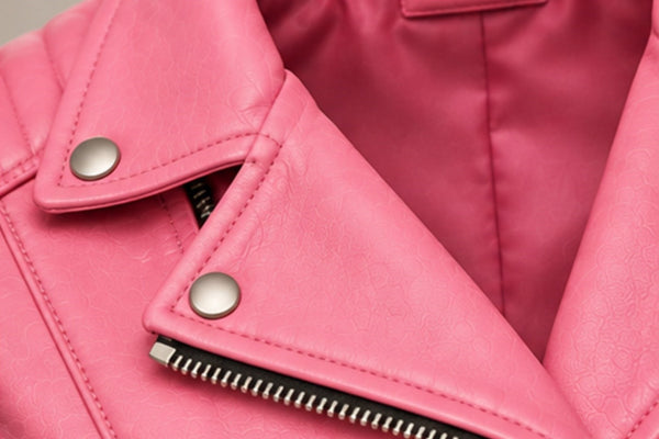 Women’s pink leather biker jacket lapel and zipper details