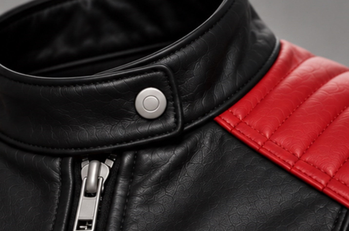 Women’s red and black leather biker jacket collar and zipper details